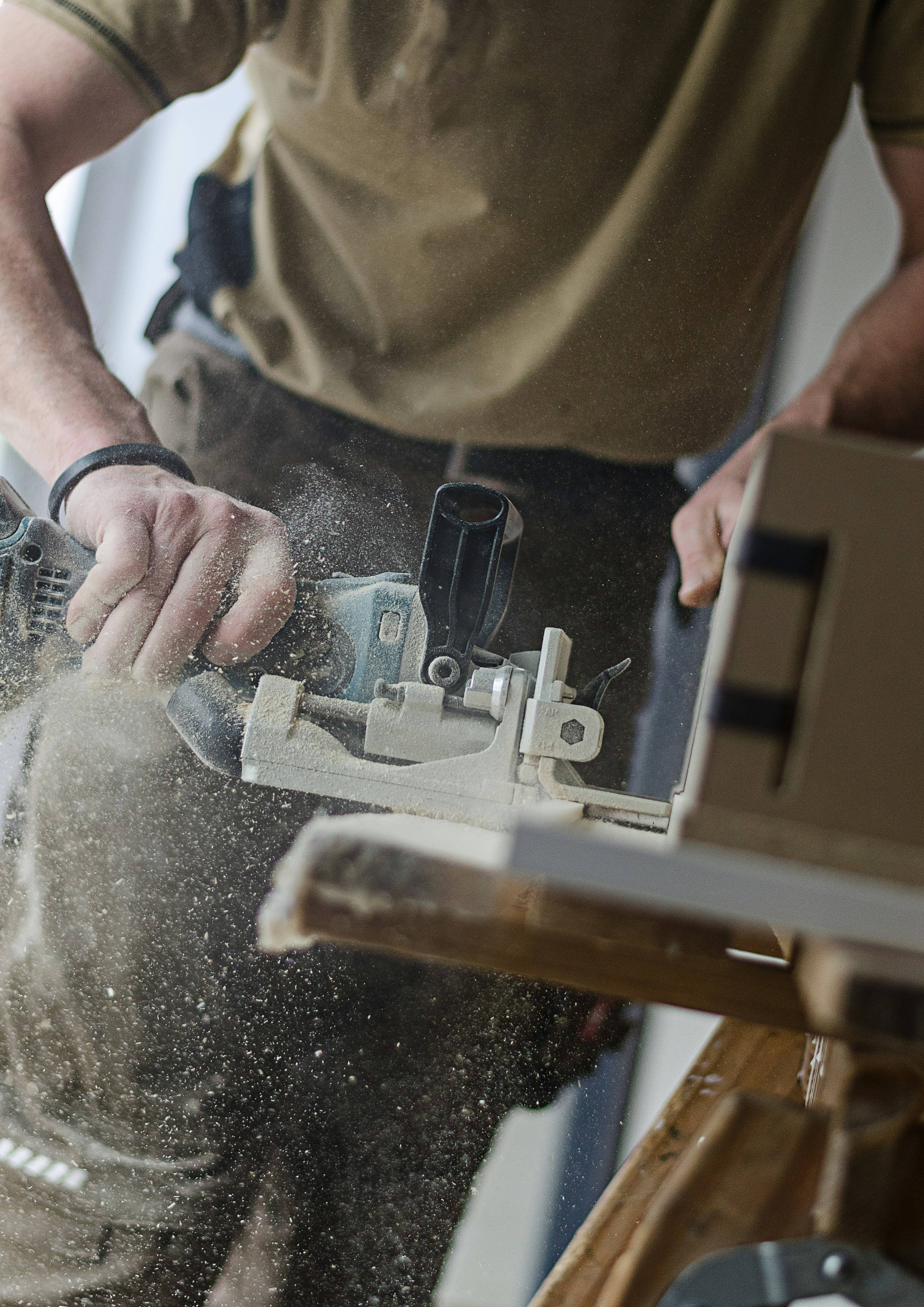 Carpenter building custom fittings for a shop lot renovation project